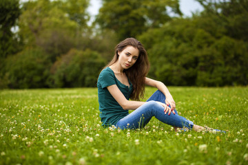Fototapeta premium Young beautiful brown haired woman in blue jeans