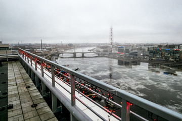 Fototapeta na wymiar The view from the height on the Neva river and television tower