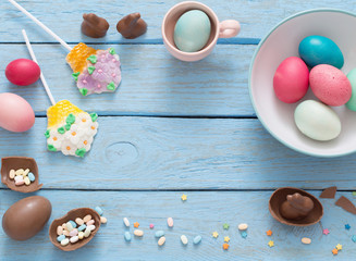 Easter Eggs Over Blue Wooden Background