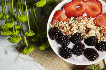 Granola served with coffee,milk,fruits
