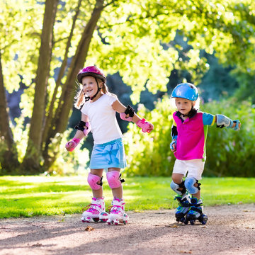 Kids roller skating in summer park