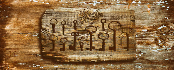 rusty medieval keys on worn out wood table