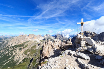 Sexten Dolomites mountain panorama and Paternkofel summit cross in South Tyrol, Italy