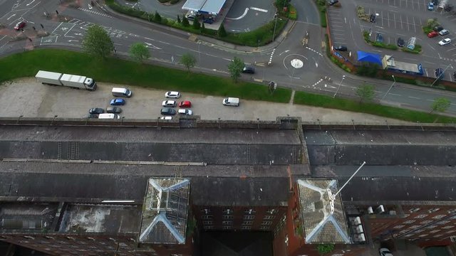 Drone shot of a old industry chimney in Manchester, England, down