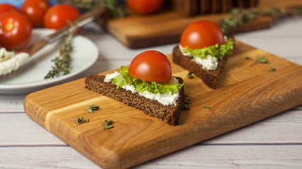 Healthy Snacks Sandwiches with goat cheese, salad, cherry tomatoes