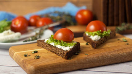 Healthy Snacks Sandwiches with goat cheese, salad, cherry tomatoes