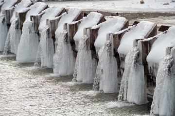 Waste water treatment plant during wintertime with ice and snow
