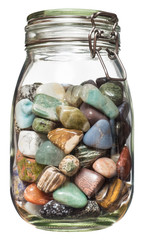 Semiprecious stones canned in glass jar, isolated on the white bacground, no shadow.