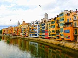Colorful yellow and orange houses in Girona, Catalonia, Spain.