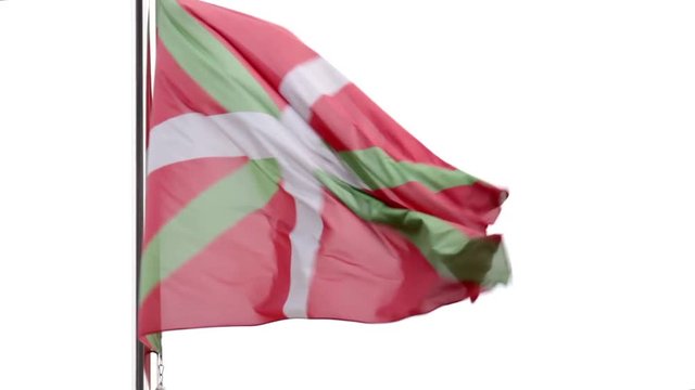 Basque Country flag fluttering in the wind. Wider angle.