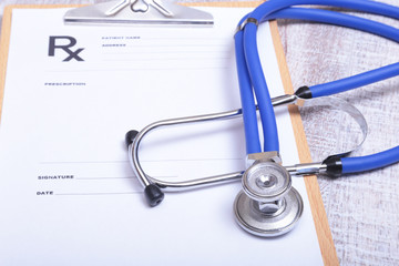 Closeup of stethoscope on a rx prescription