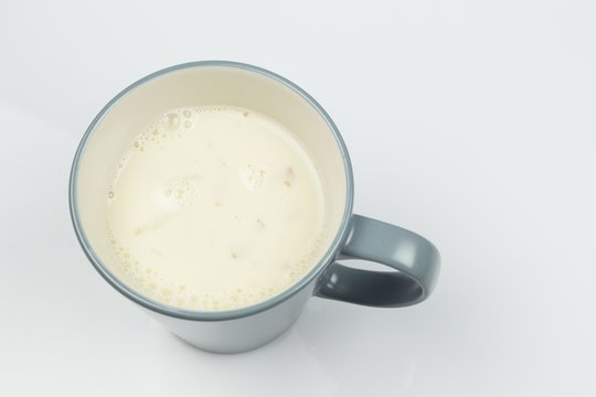 top view of glass milk. Glass of Milk From Above. Soybean milk. gray tone, Top view