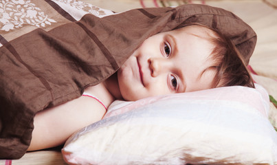 Obraz premium Baby girl relaxing in bed. Sleeping time. (Sleep, health treatme