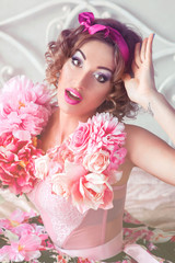 Naklejka premium portrait of young beautiful woman in colorful dress with flowers it in doll style with ara on her shoulder