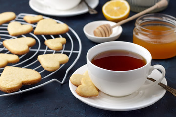 Cup of tea and heart shaped cookies for Valentines day.