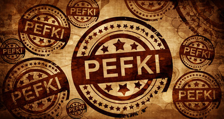 Fototapeta na wymiar Pefki, vintage stamp on paper background