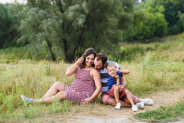 Happy Pregnant family on walk