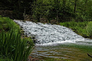 Fototapeta premium The Siewer’s Spring waterfall is a terraced waterfall that is a popular tourist attraction. Fishermen can often be found lining the banks.