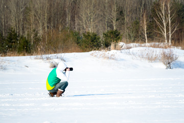 enthusiast photographer shoots report. In winter, on a frozen po