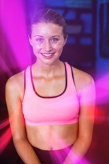 Portrait of fit smiling woman in gym