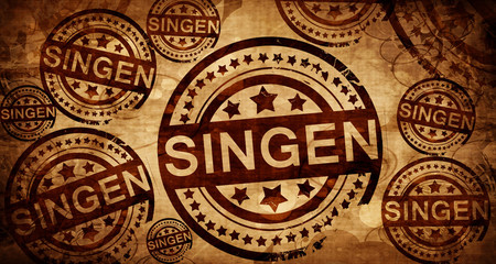 Singen, vintage stamp on paper background