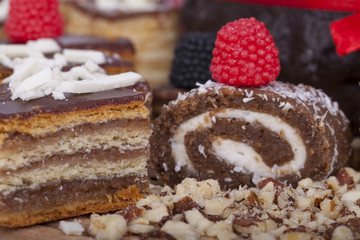 Tasty chocolate cake on a wooden base