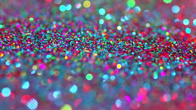 Sparkly glitter background in bright colors. Great party background texture