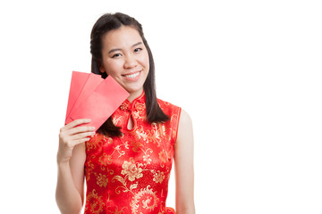 Asian girl in chinese cheongsam dress with red envelope.