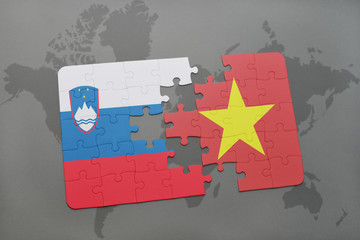 puzzle with the national flag of slovenia and vietnam on a world map