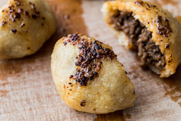 icli kofte / Boiled kibbeh / Quibe with butter sauce.