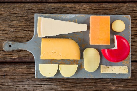 Variety of cheese on chopping board