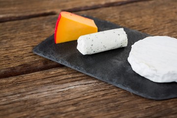 Variety of cheese on slate plate