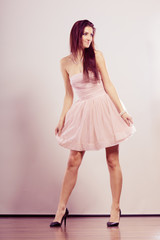 Naklejka premium woman in bright dress and high heels shoes