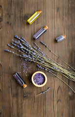 organic cosmetics with lavender on wooden background top view