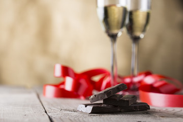 chocolate and two champagne glasses with red ribbon .valentines