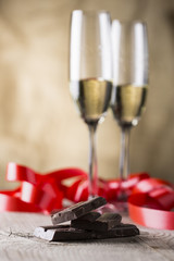 chocolate and two champagne glasses with red ribbon .valentines