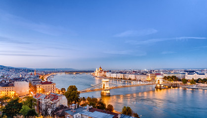 Picturesque dusk scenery of Budapest historical downtown over Danube river delta. Budapest is...