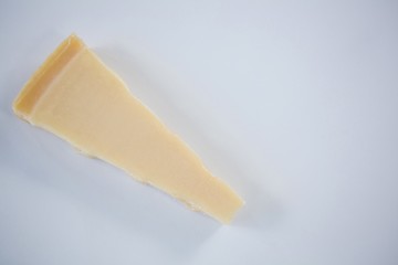 Piece of cheese on white background