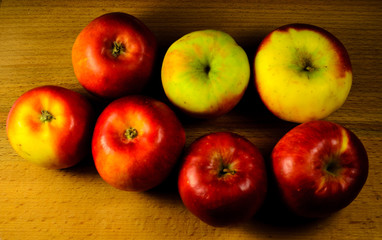 Pile of the apples on wooden table. Top view