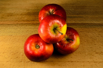 Pile of the apples on wooden table. Top view