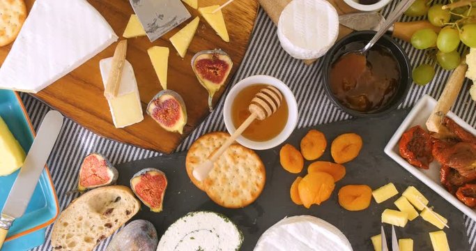 Dolly bird eye view of an assortment of French and British cheese