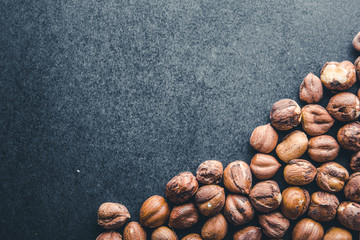 Hazelnuts isolated on black background.