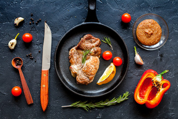 concept cooked steak on dark background top view