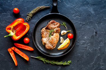 concept cooked steak on dark background top view