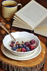 Oatmeal with berries and nuts for breakfast