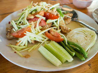 Papaya Salad (Som Tum Thai) on table, popular Thai food.