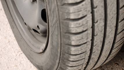 Close-up of car wheel parts - tire, rim. Vehicle components concept. Detailed shot.