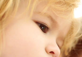 Naklejka premium Cute brown eyes on adorable face of baby boy