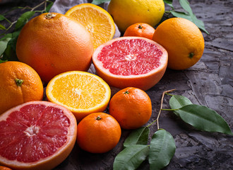 Dissected fresh fruits. Orange, grapefruit and tangerines