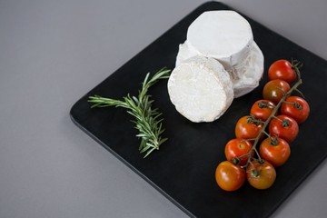 Cheese with cherry tomatoes and rosemary herb © WavebreakMediaMicro